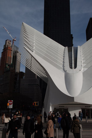 NEW YORK CITY, UNITED STATES - Mar 22, 2019: Front view of the Oculous, with people walking around...