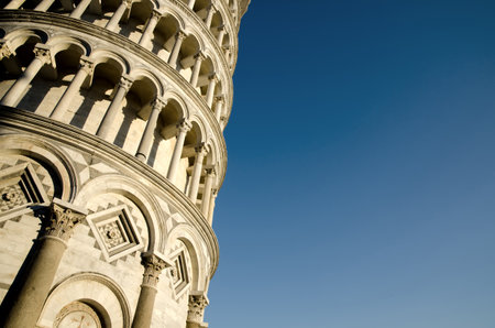 A low angle view of the Leaning Tower of Pisa under the sunlight in Pisa in Italyのeditorial素材