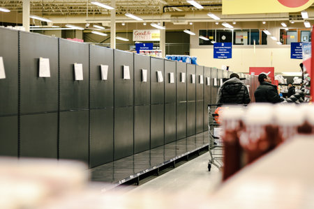 CALGARY, CANADA - Mar 13, 2020: People panic-buying leads to empty shelves and long wait times