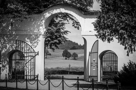 A black and white shot of a wide open gateのeditorial素材