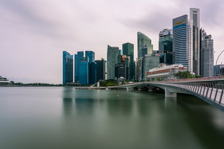 SINGAPORE, SINGAPORE - Mar 20, 2020: Singapore CBD Cityscape view with overcast clouds in the late afternoonのeditorial素材