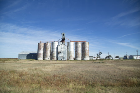 The beautiful view of the grain elevators with the blue sky in the background in the farmlands, USAのeditorial素材