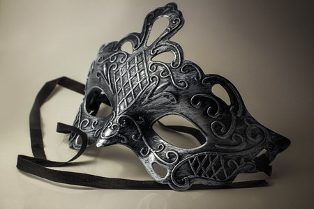 A closeup shot of a metal mask on a white surfaceのeditorial素材
