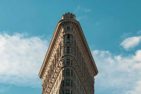 A low angle shot of Flatiron Building in Madison Square Park in New York, USA