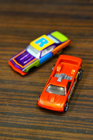 POZNAN, POLAND - Mar 13, 2020: Mattel Hot Wheels Bedlam toy car on a wooden surface in soft focus. Vertical high angle view.のeditorial素材