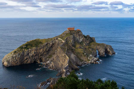 An aerial shot of San Juan de Gaztelugatxe islet surrounded by the Atlantic Ocean, Bermeo, Basque Country, Spainのeditorial素材