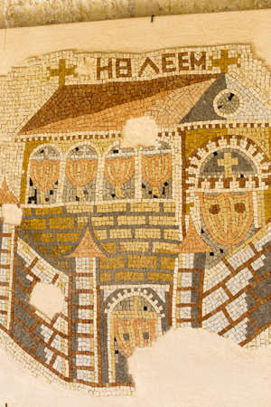 A vertical closeup shot of a mosaic mural of a church in Bethlehem