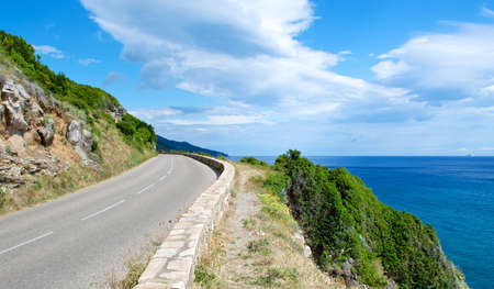 A shot of a road along the coastlineの写真素材