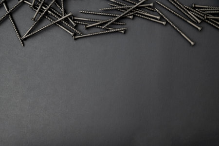 A top view of self-tapping screw on a black background