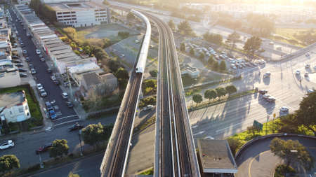 An aerial shot of the San Francisco Bay Area Rapid Transit  (BART)the  train approaches Daly City Station, USAの写真素材