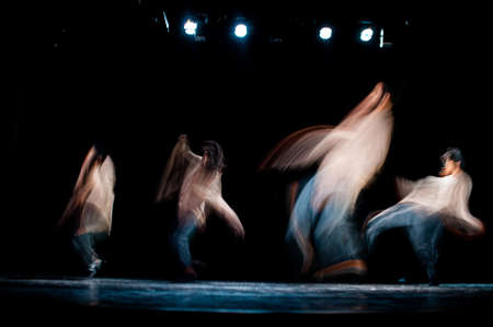 An abstract image of hip-hop dancers performing on a stageの写真素材