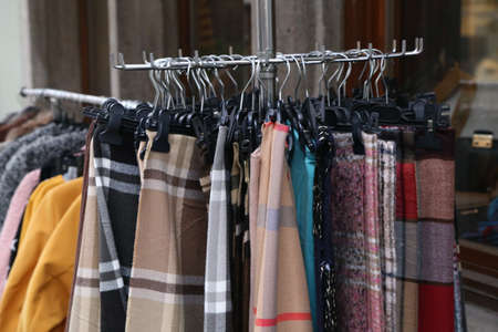 A soft focus of various autumn and winter clothes for sale at a shop