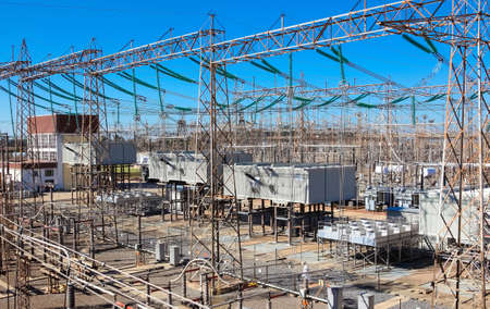 An Electricity generation and distribution site under the sunlight and a blue skyの写真素材