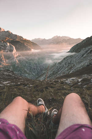 A vertical shot of roughed mountains from a first person's view during a sunny day-perfect wallpaper