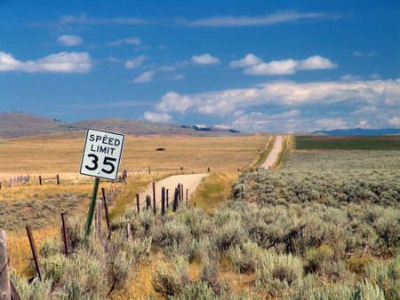 An empty country road with a speed limit of 35 mph in Montana, USA