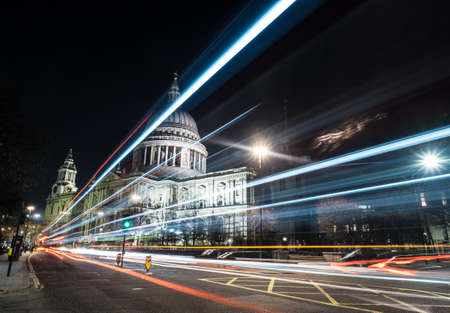 Saint Paul's Cathedral seen from London at night surrounded by city lightsの写真素材