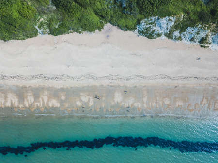 An overhead shot of a beach and a sea near Bowleaze Cove in Weymouth, UKの写真素材