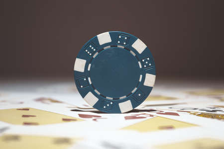 A selective focus shot of blue poker chip - casino and gambling conceptの写真素材
