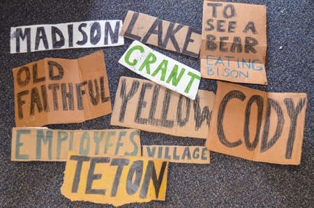 A top view of cards with places names for hitchhiking