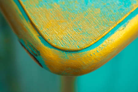 A closeup shot of textured wood with yellow and blue grunge paint, isolated wallpaperの写真素材