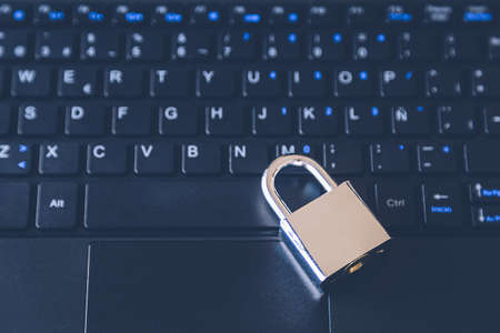 A padlock on a computer keyboard - cybersecurity conceptの写真素材