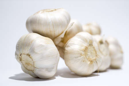 A closeup shot of garlic on a white backgroundの写真素材