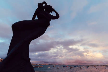 A low angle shot of a mermaid statue in Cascais, Portugalの写真素材