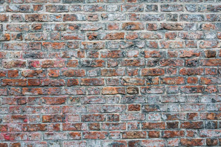 A shot of a cemented red and brown brick wall - great for wallpapers