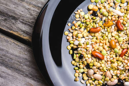 A selective focus shot of mixed beans in a plate