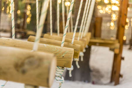 A closeup shot of rope wooden swingsの写真素材