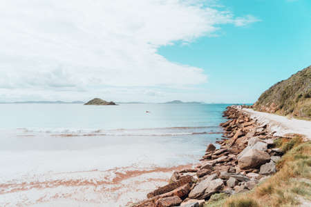 A landscape view of the beach in Rio near the sandy roadの写真素材