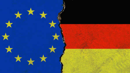 An EU and German flag on a cracked wall-politics, war, conflict conceptの写真素材