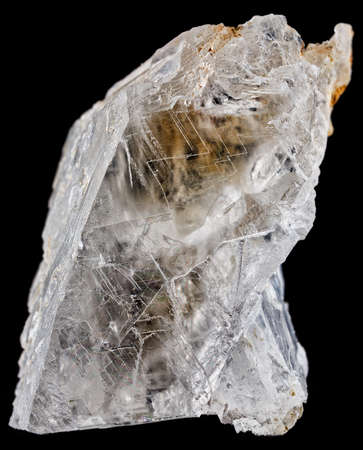 A vertical shot of the Selenite mineral isolated on black background