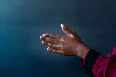 A closeup shot of the soaped hands of a person - importance of washing hands during the coronavirus pandemicの写真素材