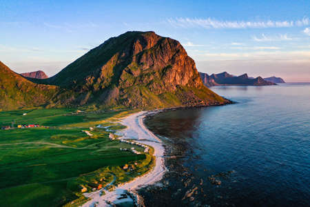 Aerial view of the Uttakleiv beach, sunny, summer evening sunset, in Lofoten, Vestvagoy, Norway -...