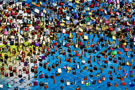 A wall with thousands of colorful padlocks, a famous tourist destination in Mala Strana, Prague, Czech Republicのeditorial素材