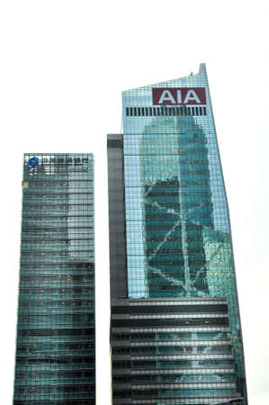 HONG KONG, CHINA - Jun 10, 2013: HONG KONG, June,10 2013: Bank of China tower reflected over the...