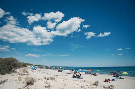 SINISCOLA, ITALY - Sep 01, 2020: people sunbathing at wild berchida beach, nuoroのeditorial素材