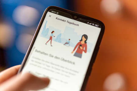 BERLIN, GERMANY - Feb 17, 2021: Contact diary of the Corona Warn app in Germany provides tips for...
