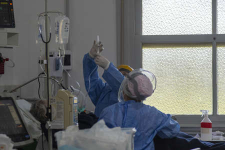 FIRMAT, ARGENTINA - Nov 08, 2020: Health workers inside a COVID-19 ICU in a countryside Hospitalのeditorial素材
