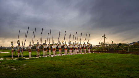PONTE DE LIMA, PORTUGAL - Oct 28, 2019: Statues of Roman soldiers near Lima River at Ponte de Lima.