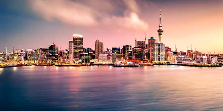 AUCKLAND, NEW ZEALAND - Aug 18, 2018: Panoramic view of Auckland city skyline and harbour at sunset. Auckland is known as the "City of Sails" and will host the America's Cup in 2021.のeditorial素材
