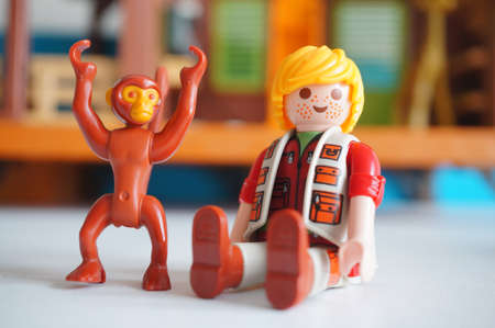 POZNAN, POLAND - Feb 21, 2017: Playmobile sitting ranger and monkey figurine in soft focus backgroundのeditorial素材