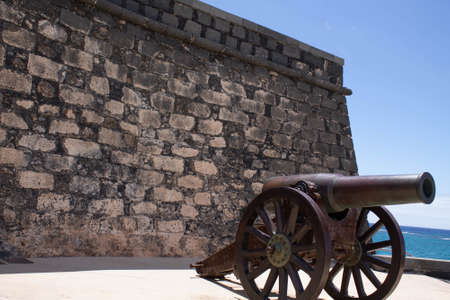 ARRECIFE, SPAIN - Oct 31, 2020: canyon next to stone wall Castle San Gabriel city of Arrecife on the island of Lanzarote. Canary Islands, Spainのeditorial素材