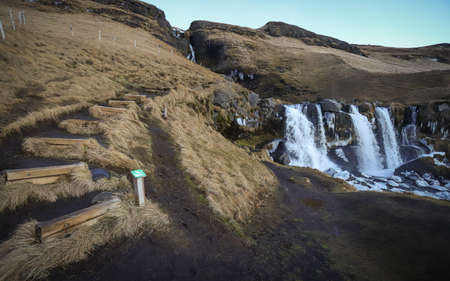 HVOLSVOLLUR, ICELAND - Dec 10, 2018: A signed trail leads to the steep falls of Gluggafoss Waterfall, also called Merkjarfoss, in Southern Iceland.のeditorial素材
