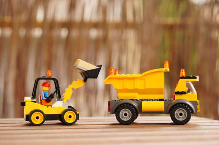 POZNAN, POLAND - Jun 06, 2017: Lego construction work toy set on a wooden table