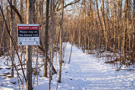 MISSISSAUGA, CANADA - Jan 28, 2021: Private land sign on the Bruce Trail, Ontario, Canadaのeditorial素材