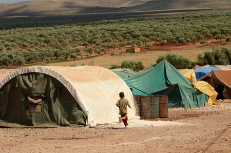 IDLIB, SYRIA - Jun 17, 2013: Atmeh Refugee Camp, Idlib, Syria. June 19th 2013. 
Internally displaced child Syrian refugees in the Atmeh refugee camp, Idlib province Syriaのeditorial素材