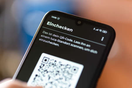 BERLIN, GERMANY - Mar 16, 2021: Smartphone with the new developed Luca Corona App opened. The app was built  in the fight against covid-19 pandemic.のeditorial素材
