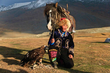 ULGII, MONGOLIA - Sep 29, 2019: Hunting with Eagle is very old and generation cultures of Kazakh Nomads. They lived in Mongolia as Western site. Also they herding the their animalsのeditorial素材
